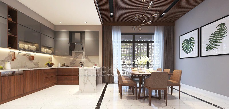 Sắp xếp nội thất phòng bếp liền phòng ăn sang trọng, độc đáo với nội thất gỗ chủ đạo từ tủ bếp, bộ bàn ghế, tường ốp gỗ tại biệt thự, nhà phố Vinh, Nghệ An. Thiết kế nội thất phòng ăn biệt thự